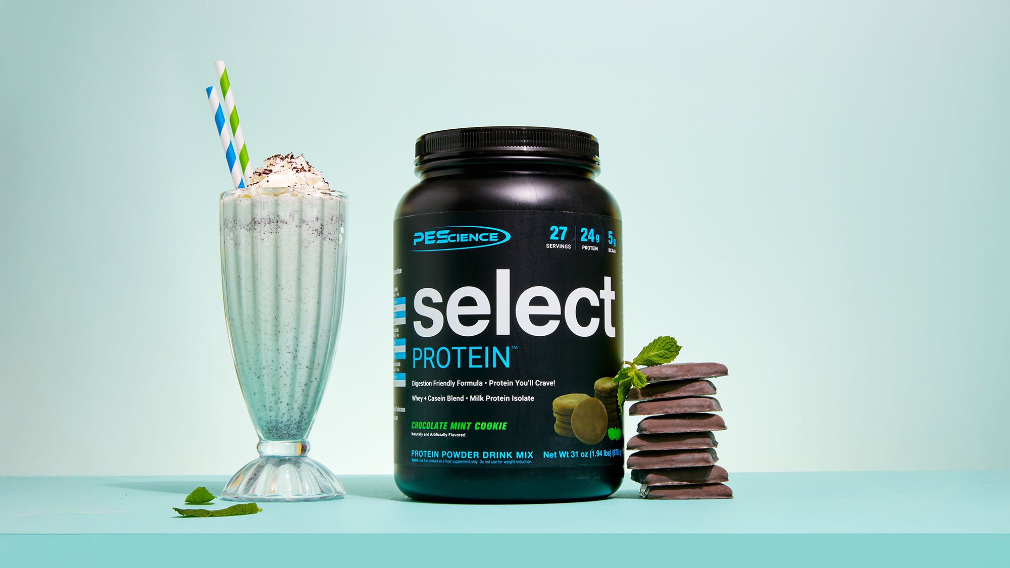 chocolate mint cookie select protein powder next to chocolate mint cookies and a milkshake