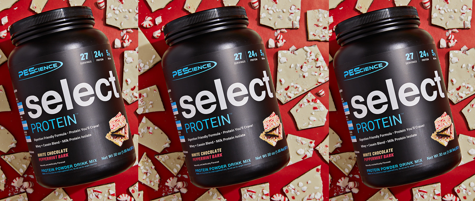 Three containers of PEScience Select Protein on a red background with cookies.